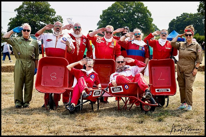 Full team saluting at summer show