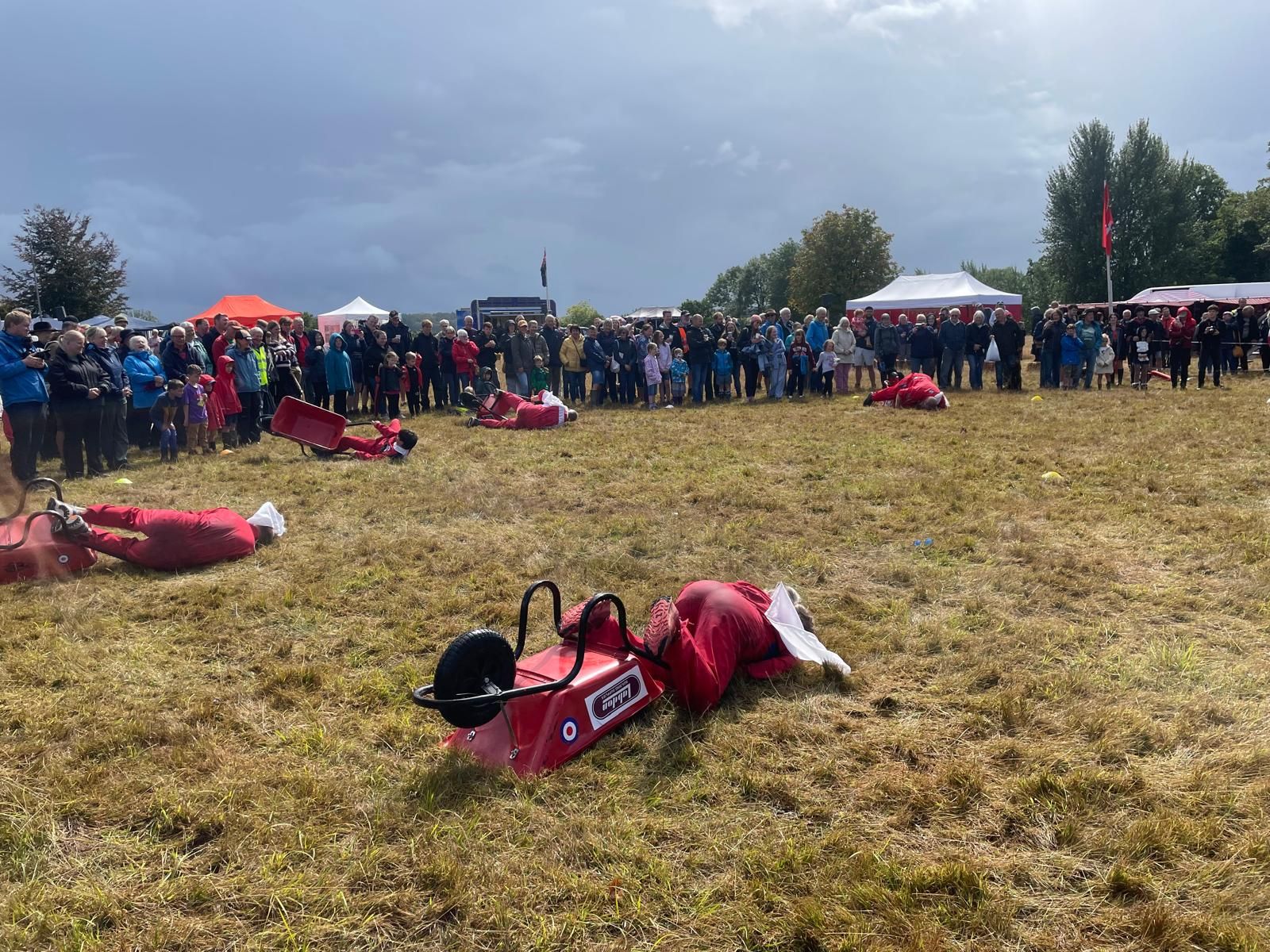 Team sprawled on ground after performance